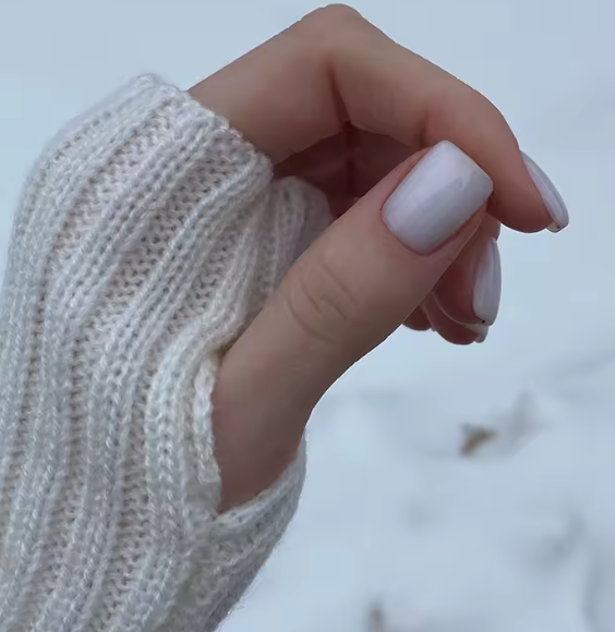 Mitaines longues femme sans doigts en maille tricotée beige texture douce hiver printemps 2026